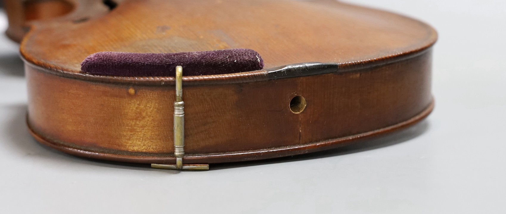 A cased 19th century violin, labelled Stradivarius 1690, with a Dodd bow